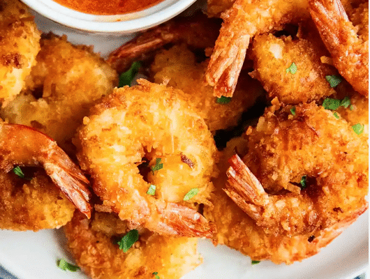 Coconut battered fried shrimp served with sweet & sour sauce